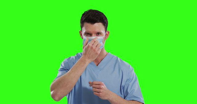 Healthcare Worker Adjusting Face Mask on Green Screen Background - Download Free Stock Images Pikwizard.com