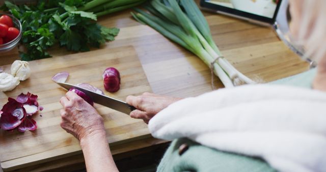 Elderly Woman Chopping Vegetables on Kitchen Counter - Download Free Stock Images Pikwizard.com