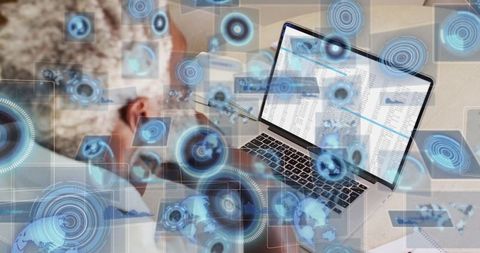 Professional analyzing data on laptop with futuristic ui elements