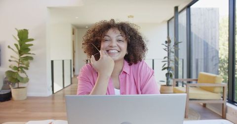Cheerful Woman Working from Bright Home Office