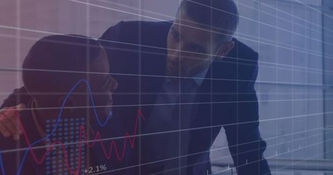 Businessmen discussing financial growth analytics