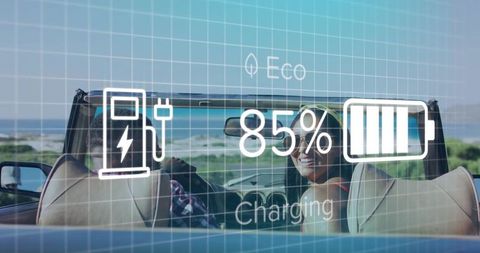 Couple cruising convertible along coastal road with electric hud showing 85% charging