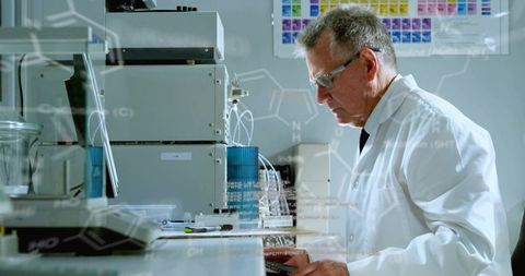 Senior Scientist Conducting Chromatography Analysis at Instrument Bench in Research Lab