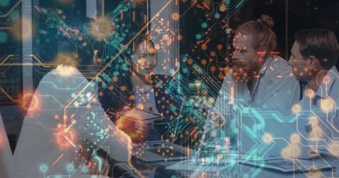 Business team collaborating with tablet and documents overlaid with digital circuit network