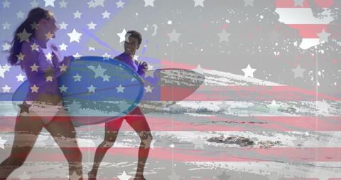 Joyful Couple with Surfboards on Patriotic Beach