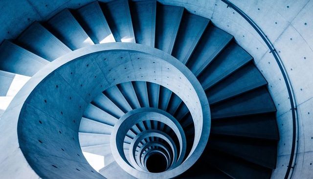 Descending Concrete Spiral Staircase with Circular Void, Geometric Symmetry, Helix