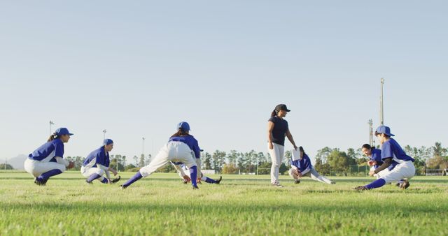 Baseball Coach and Team Stretching On Field - Download Free Stock Images Pikwizard.com