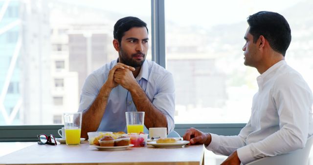 Business Professionals Having Breakfast Meeting in Modern Office - Download Free Stock Images Pikwizard.com