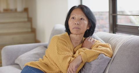 Senior Chinese Woman Relaxing at Home in Cozy Attire