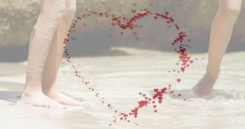 Children enjoying beach waters with heart symbol