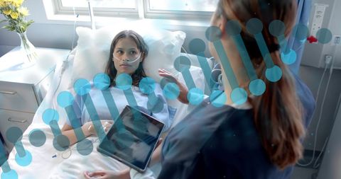 Patient in Hospital Bed Discussing Healthcare Technology with Nurse