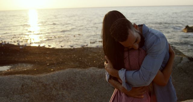 Couple Embracing by Ocean at Sunset - Download Free Stock Images Pikwizard.com