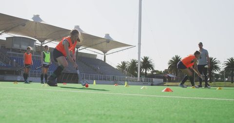 Hockey Team Practicing Drills on Outdoor Field