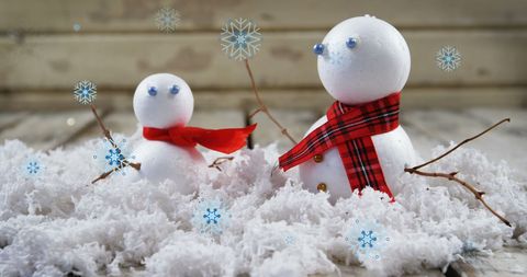 Festive Snowmen with Red Scarves Amidst Falling Snowflakes - Download Free Stock Images Pikwizard.com