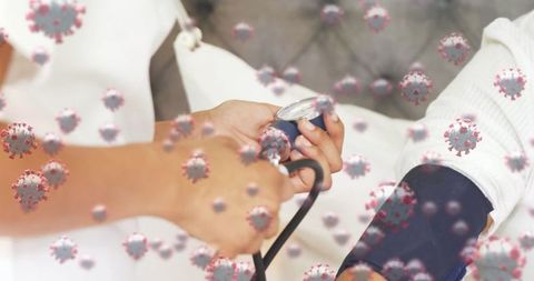 Healthcare Worker Checking Blood Pressure Amid Covid-19