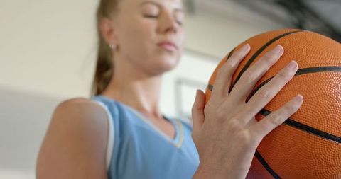 Female Basketball Player Focused on the Game in Gym