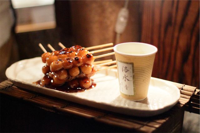 Traditional Japanese Dango with Soy Sauce and Cup - Download Free Stock Photos Pikwizard.com