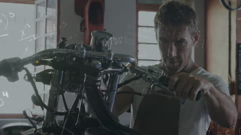 Mechanic Solving Mathematical Equations in Workshop