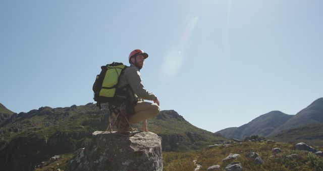 Hiker with Backpack Surveying Mountain Landscape Under Clear Sky - Download Free Stock Images Pikwizard.com