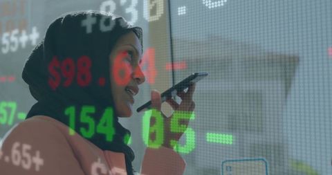 Business Executive Analyzing Statistics with Talk-to-Text Technology