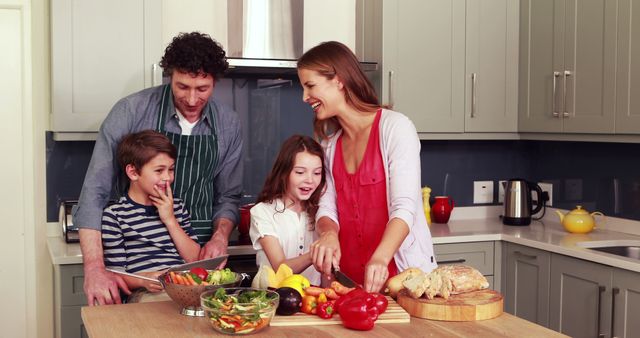 Family with two children preparing a healthy meal in a modern kitchen, discussing and laughing together. Parents and kids are working together, promoting family bonding, healthy eating, and teamwork. Ideal for use in advertisements promoting family values, home cooking, nutrition awareness, and kitchen products.