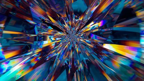 Radiating crystal shards converging toward vanishing point in kaleidoscopic prism tunnel