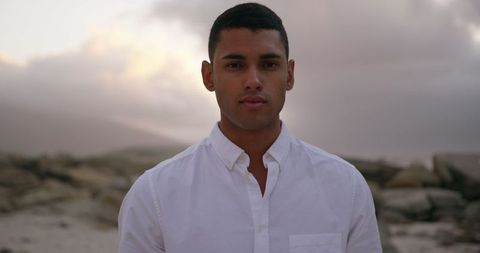 Serene Portrait of Man on Beach During Dusk - Download Free Stock Images Pikwizard.com