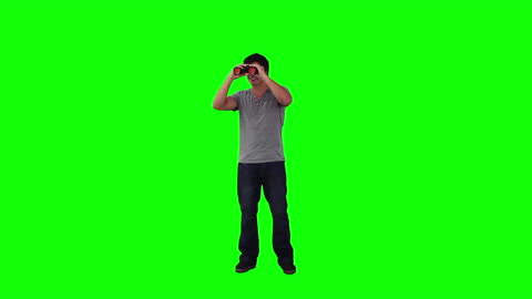 Man Observing with Binoculars on Green Background