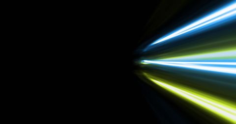 Dynamic colorful light streaks on black background