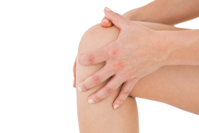 Woman Touching Sore Knee with Painful Expression Isolated on Transparent Background - Download Free Stock Videos Pikwizard.com