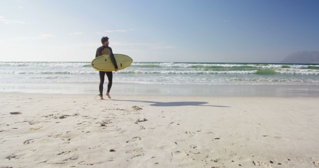 Surfer with Board Looking Out at Ocean Waves on Sunny Beach - Download Free Stock Images Pikwizard.com