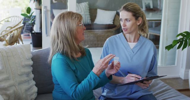 Home Health Nurse Discussing Medication with Elderly Woman - Download Free Stock Images Pikwizard.com