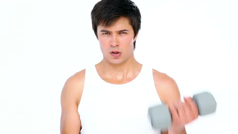 Man Working Out with Dumbbell for Muscle Training