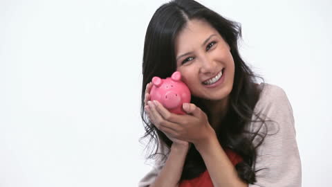 Smiling Woman Holding Pink Piggy Bank Enjoying Saving Money