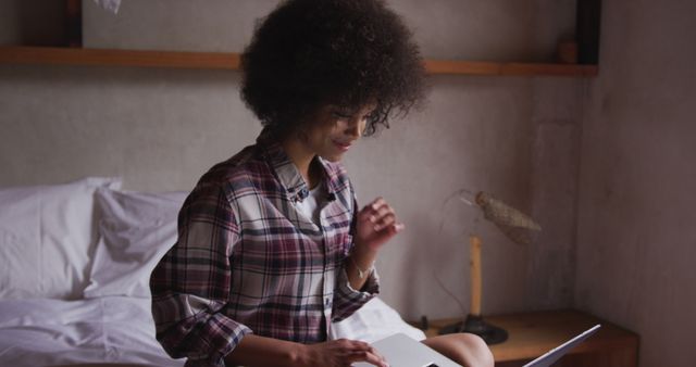 Young Woman Working on Laptop in Cozy Bedroom - Download Free Stock Images Pikwizard.com