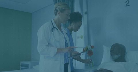 Medical Team Caring for Patient in Hospital Room