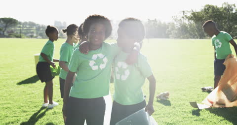 Smiling Children Participating in Eco-friendly Recycling Activity