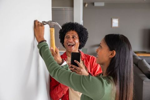 Couple collaborating on home improvement project while smiling