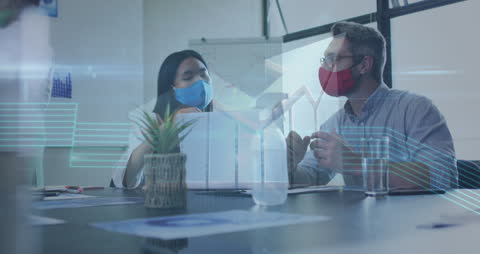 Diverse Colleagues Analyzing Data with Technology Interface in Modern Office