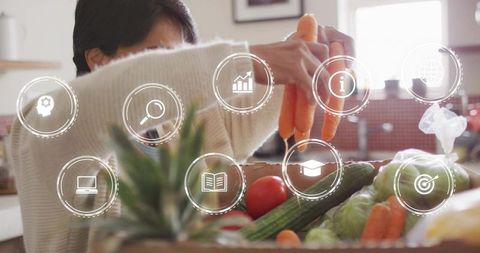 Senior woman arranging fresh produce on kitchen counter with health and tech icons