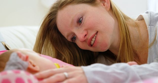 Mother Smiling Tenderly at Newborn Baby - Download Free Stock Images Pikwizard.com