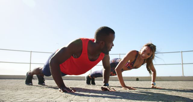 Fit Diverse Friends Doing Outdoor Push-ups on Sunny Day - Download Free Stock Images Pikwizard.com