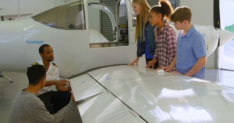 Pilot Teaching Aspiring Young Aviators About Aircraft - Download Free Stock Images Pikwizard.com