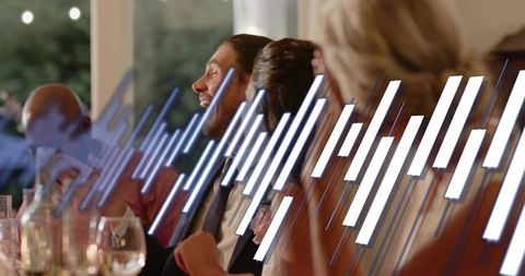 Laughing bearded man in suit at elegant evening banquet with digital music equalizer overlay