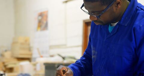 Professional Carpenter Skillfully Utilizing Geometry Compass in Workshop - Download Free Stock Images Pikwizard.com