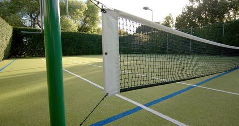 Serene Tennis Court in Golden Evening Sun