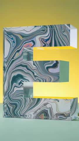 Futuristic 3D Letter E Sculpture Vertical Video with Marble Swirl and Glowing Yellow Bars
