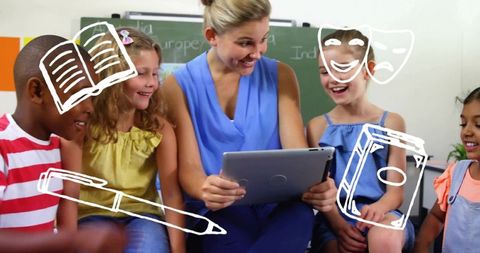 Elementary teacher engaging diverse students with tablet for classroom learning