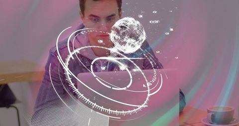 Man Typing with Holographic Data Overlay in Modern Workspace