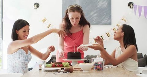 Friends Celebrating Birthday with Cake and Laughter